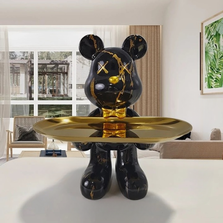Modern decorative bear figurine holding a small service tray
