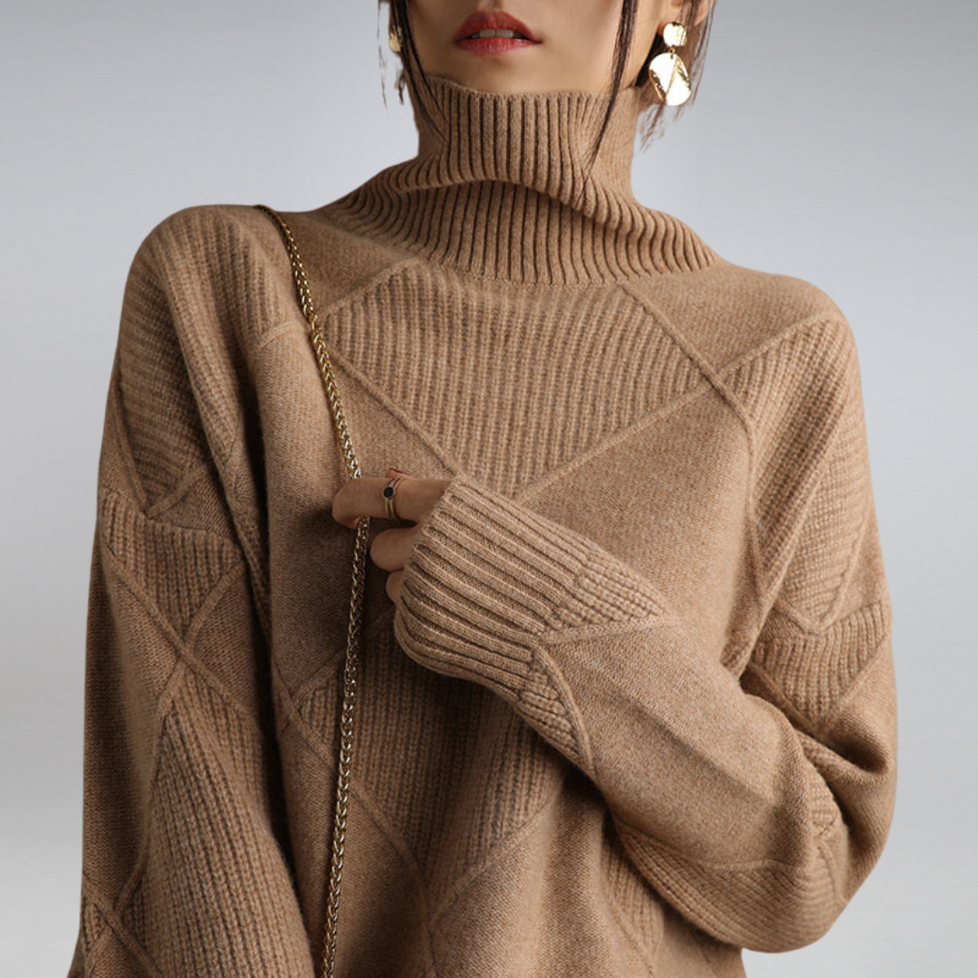Women's turtleneck knit sweater folded neatly, showing soft winter fashion knitwear fabric.