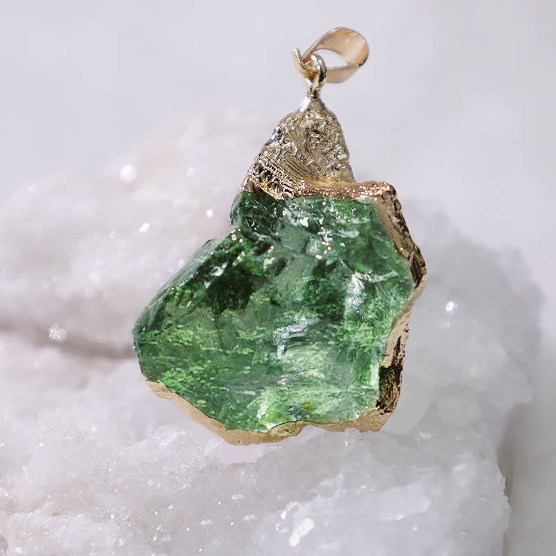Statement crystal necklace with a raw green Moldavite stone in a setting