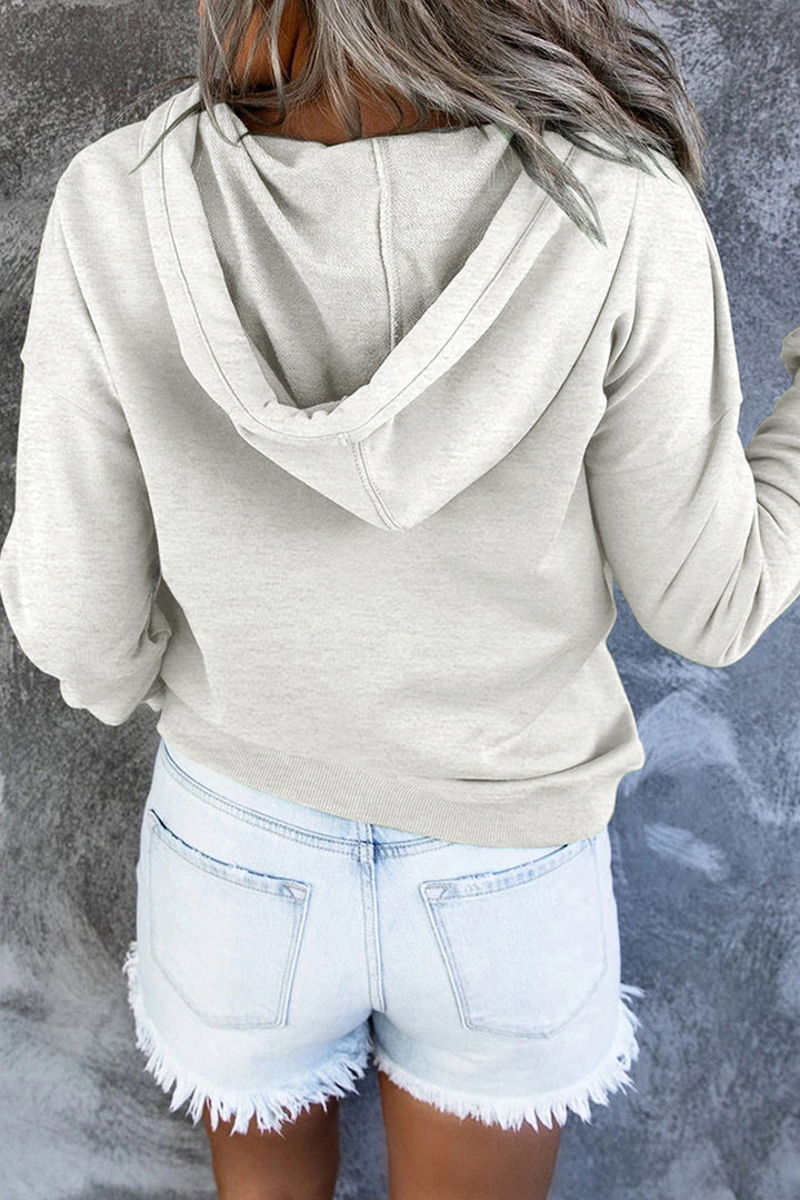 Green cosy hooded sweater styled for autumn wear