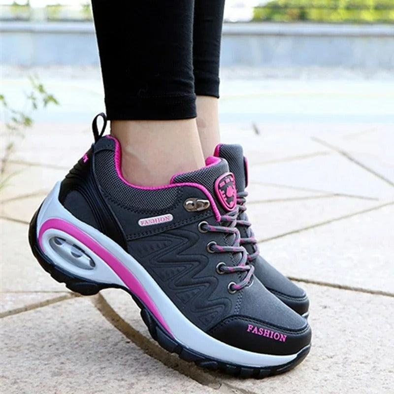 Close-up of pink orthopedic shoe insole demonstrating arch support