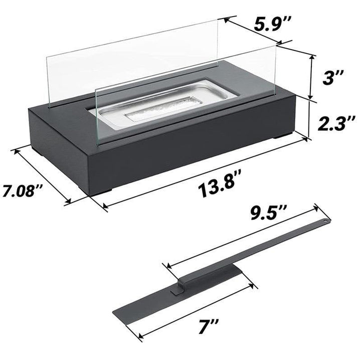 Minimalist glass and black metal tabletop fireplace viewed from a slight angle