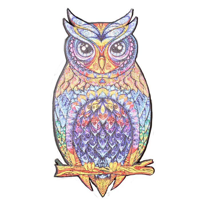 Assembled colorful wooden owl puzzle on a white background