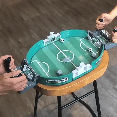 Close-up of control rods and rubber grips on a portable tabletop foosball game