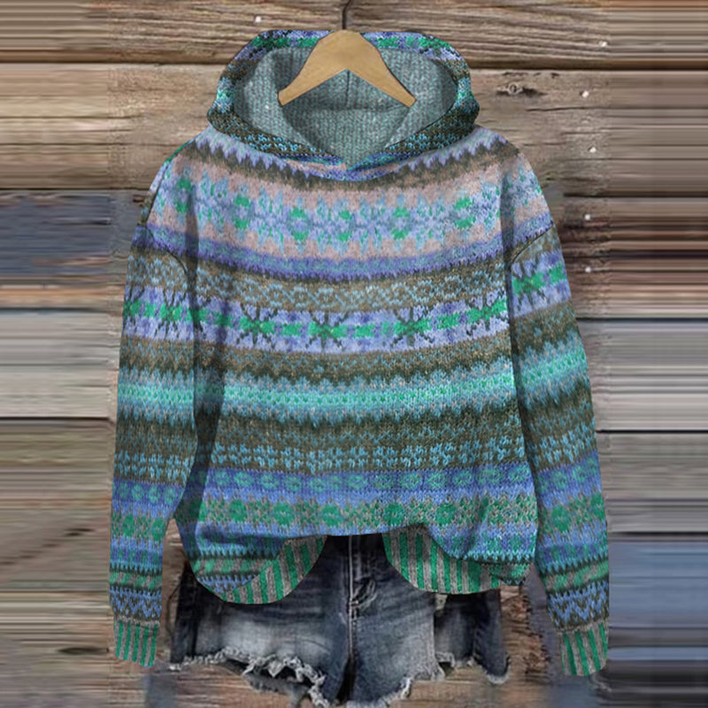 Women's blue vintage Fair Isle hooded sweater on a wooden background