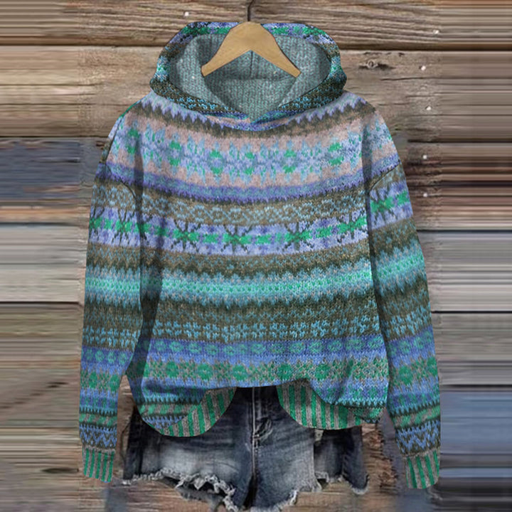 Women's blue vintage Fair Isle hooded sweater on a wooden background