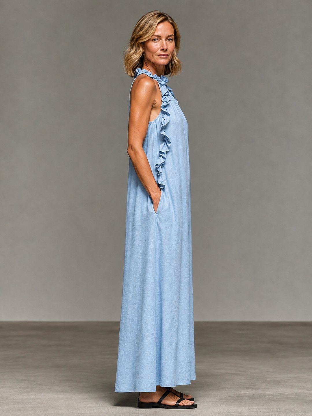Side profile of women's Melva maxi dress in light blue, casual wear