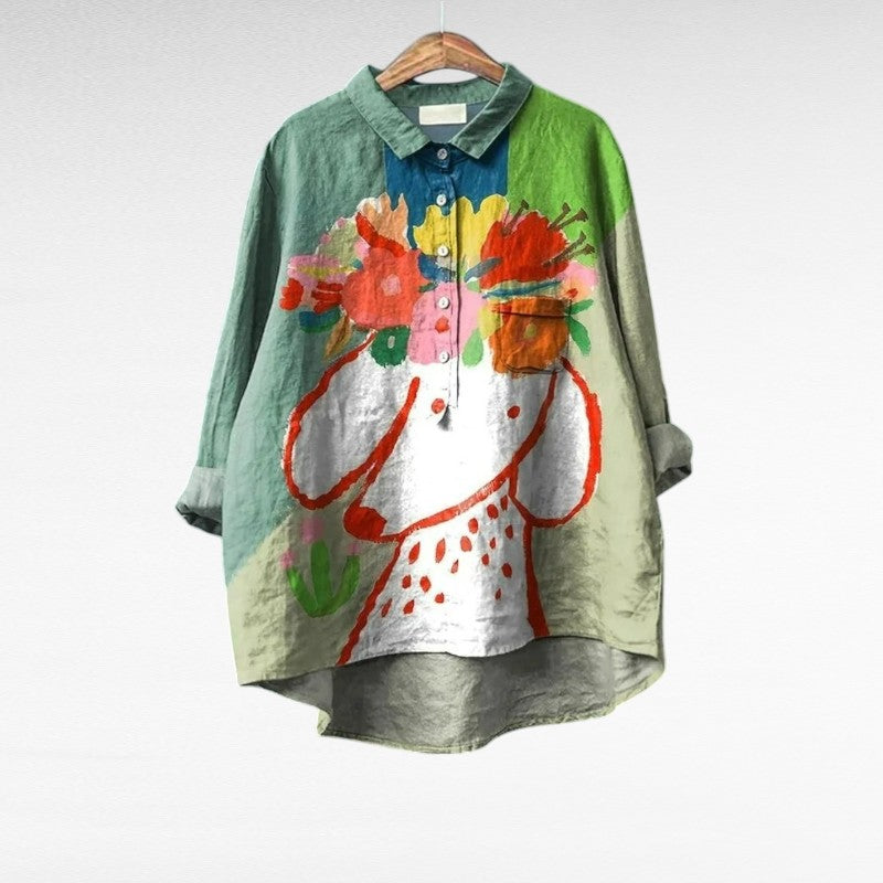 Women's elegant multicolor artistic print summer blouse displayed on hanger