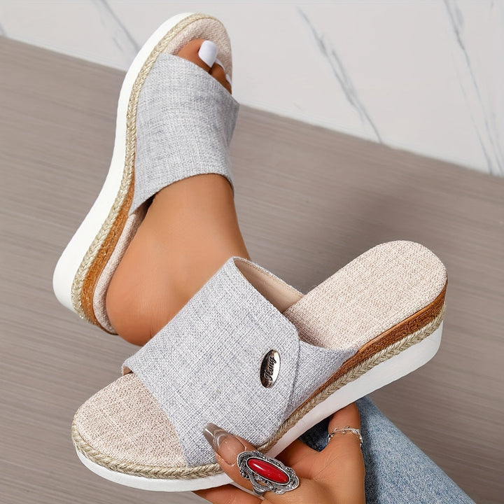 Side profile of women's platform wedge sandals showing heel lift