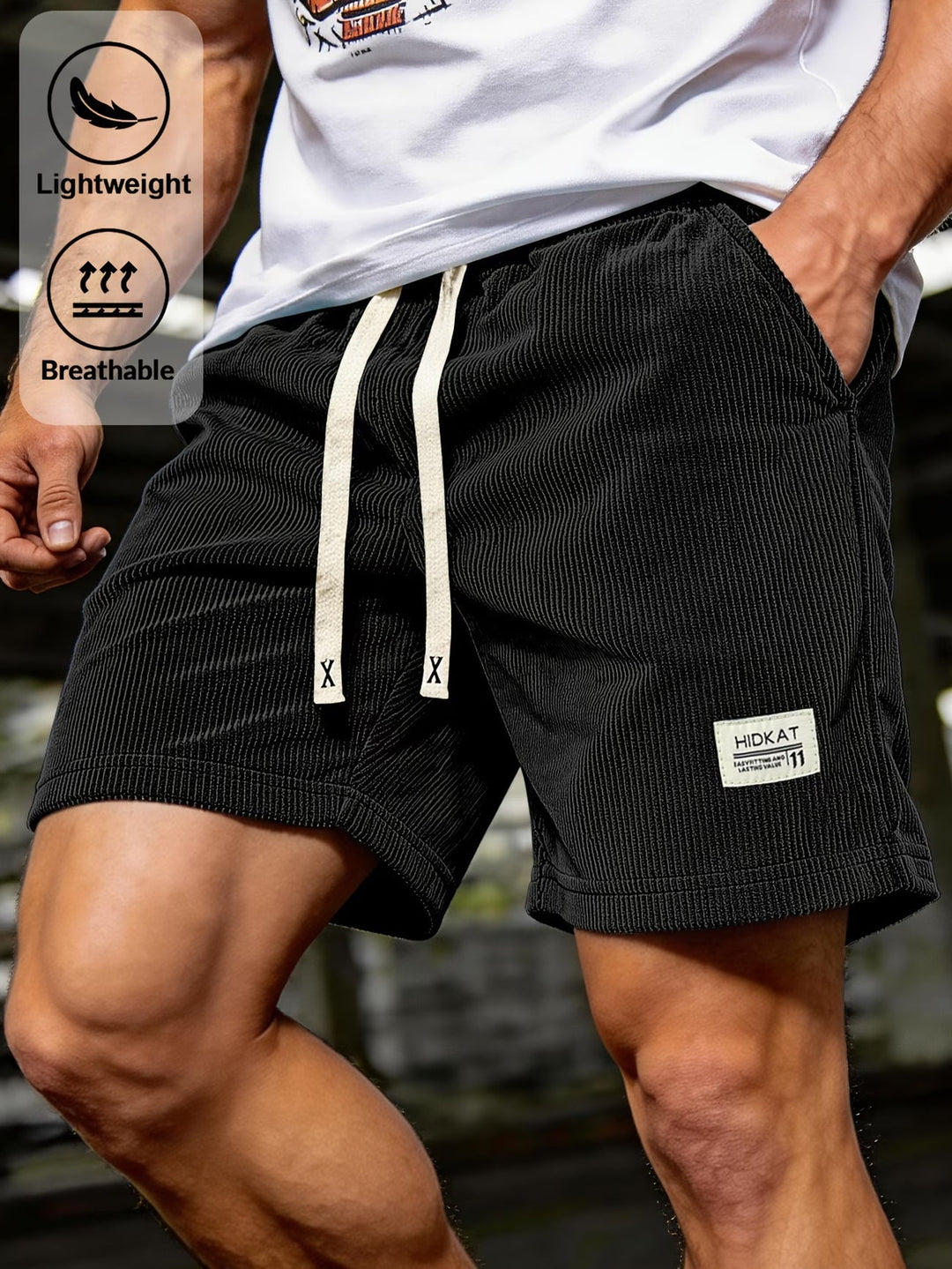 Men wearing black casual textured lace-up shorts with lightweight and breathable icons