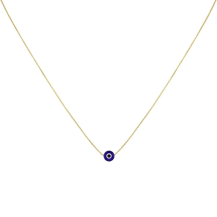 Close up of glossy evil eye charm pendant on delicate chain