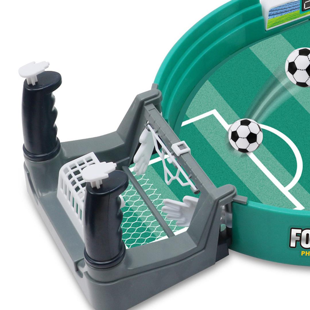 Detailed view of the handles and protective net on the mini football table