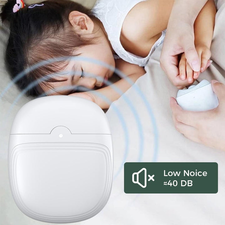 Clean white and green electric nail clipper set with small cleaning brush