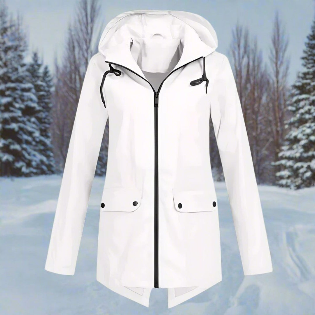 Folded women's packable rain jacket showing compact travel design