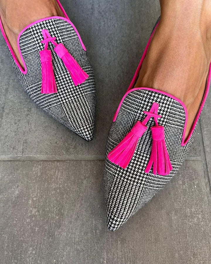 Side view of stylish pink fringed pointed flats for women