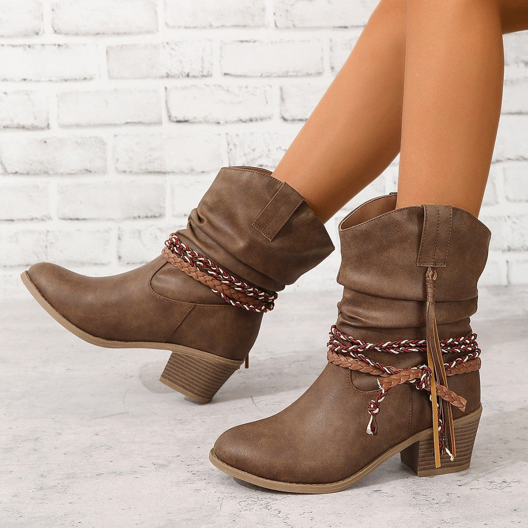 Dark brown vintage cowboy tassel ankle boots with braided strap detail