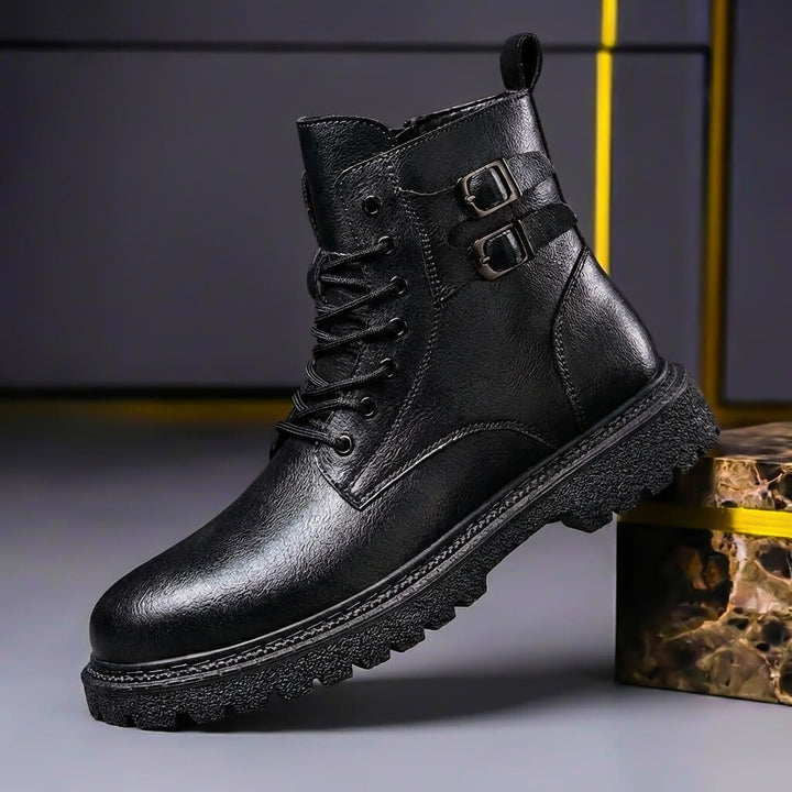 Side profile of black men's vintage ankle boots with buckle detail