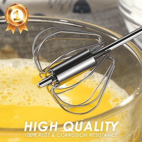 Manual mixer whisk pressing down to show spring action