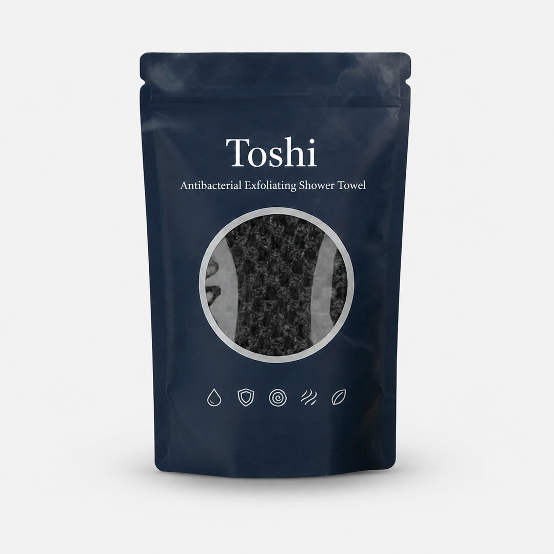 Packaged antibacterial exfoliating shower towel in dark pouch