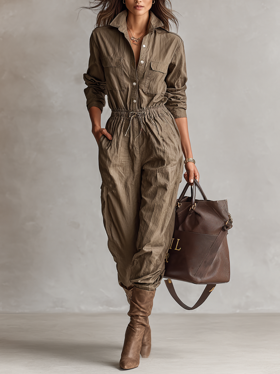 Model wearing a casual olive button-down jumpsuit with a matching handbag and boots
