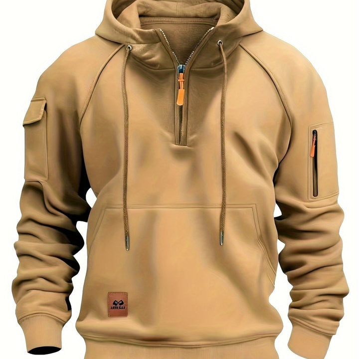 Close-up of shoulder seam and yoke construction on men's hoodie.