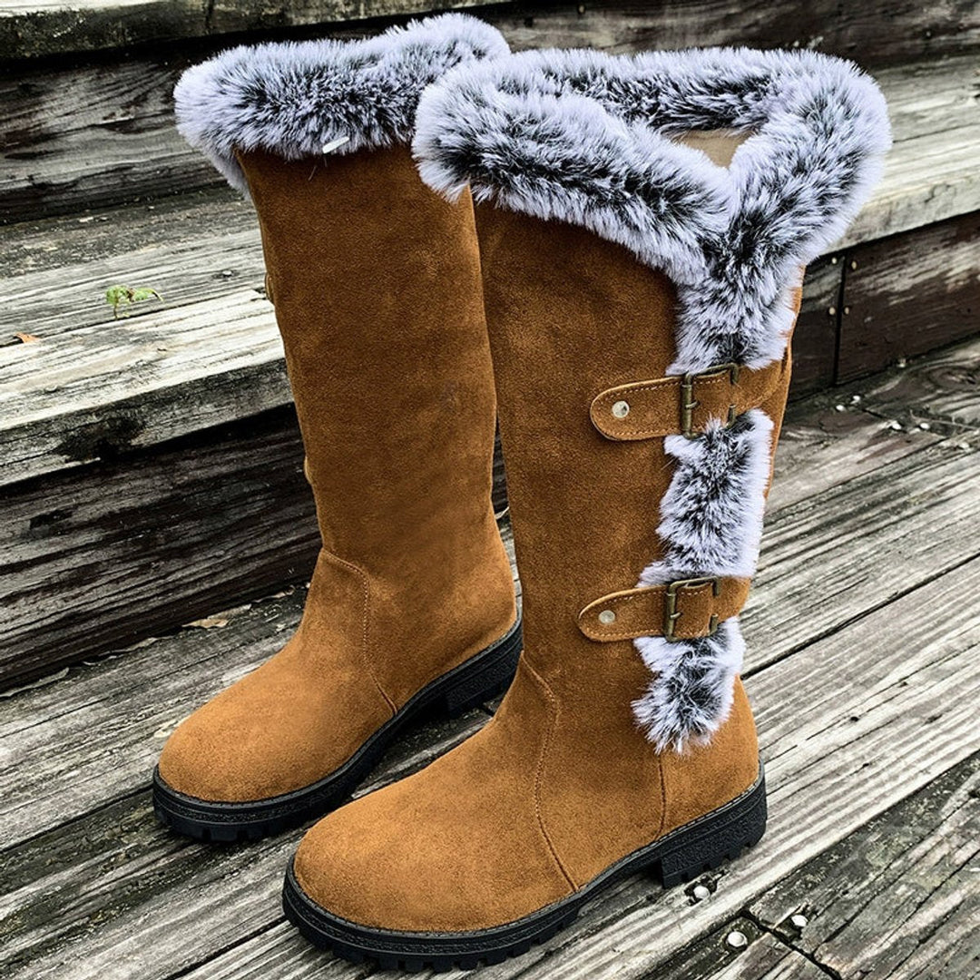 Angled shot of buckled knee-high boots styled for winter wear