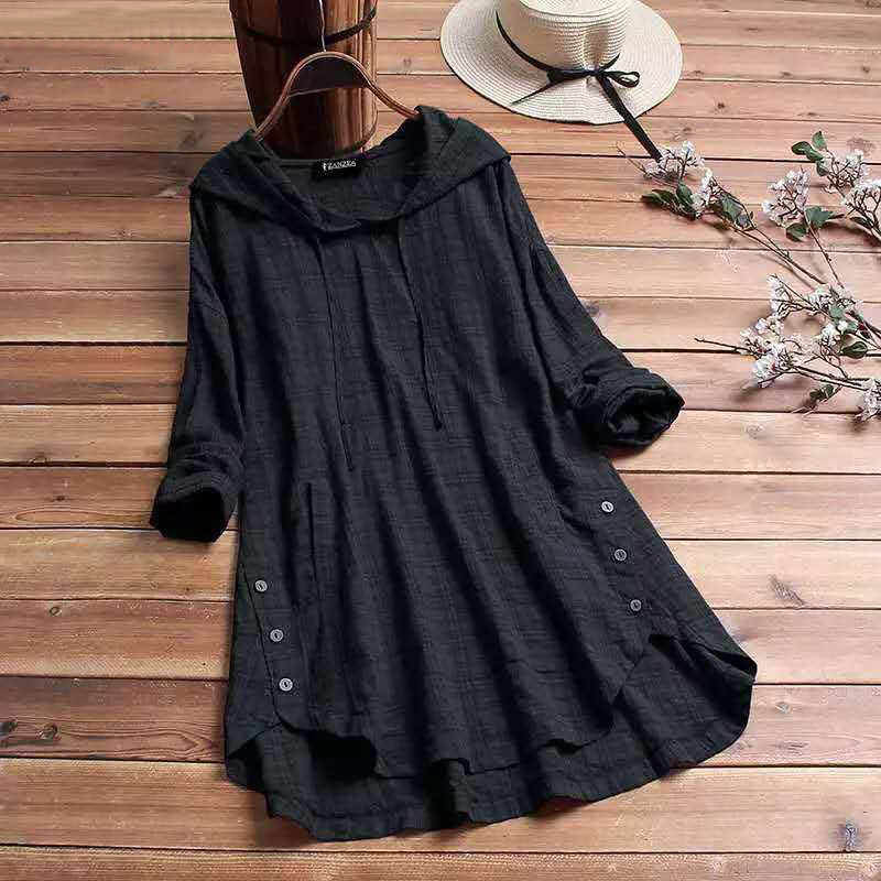 Black women's hooded tunic top with side buttons displayed on wooden background