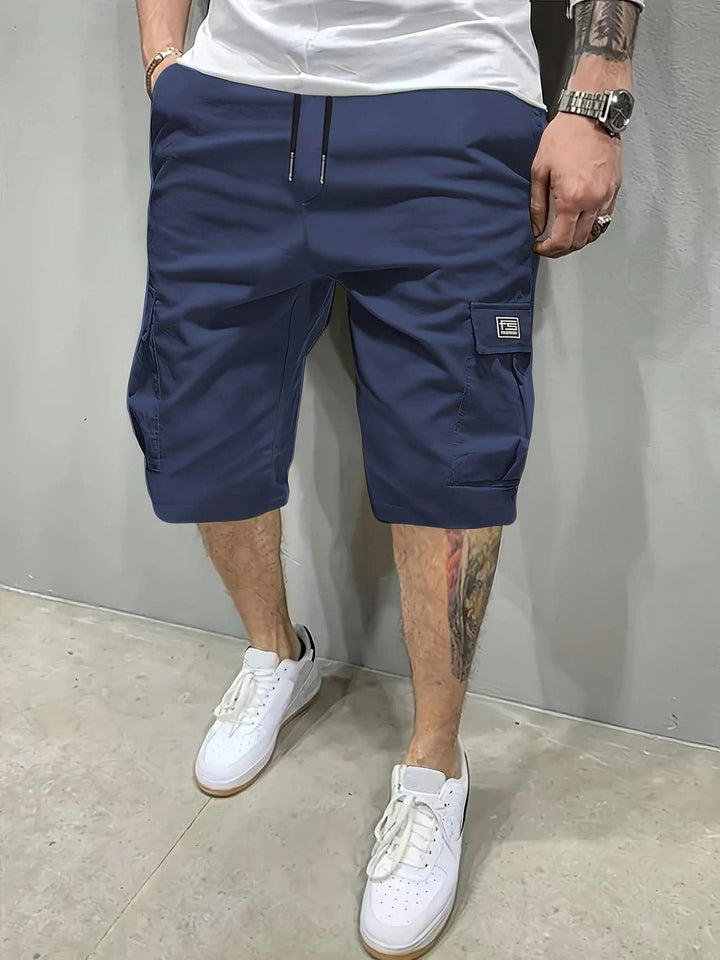 Close up view of durable fabric and stitching on mens utility shorts