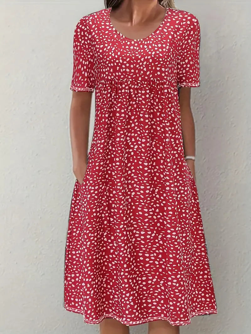 Woman wearing red printed short sleeve midi dress with pockets