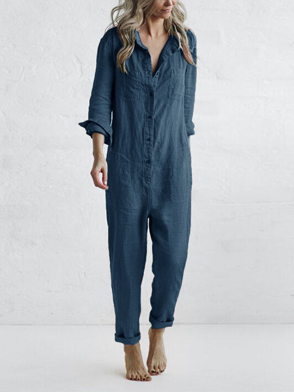 Woman wearing a blue long sleeve button-front jumpsuit