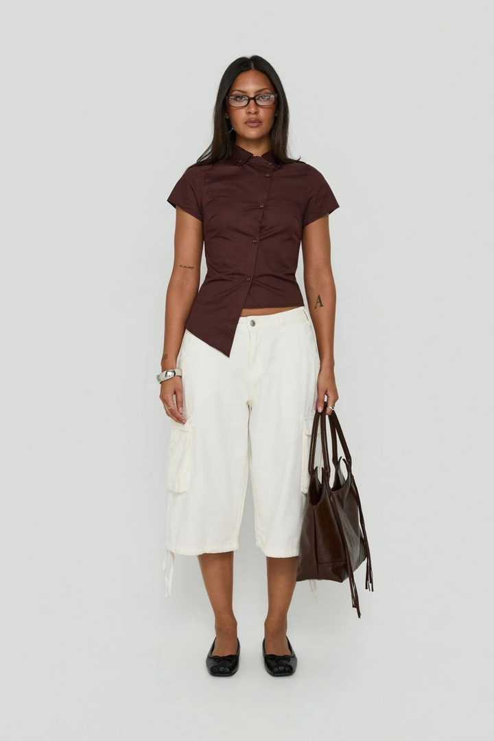 Close-up of belt loops and stitching on women's casual shorts