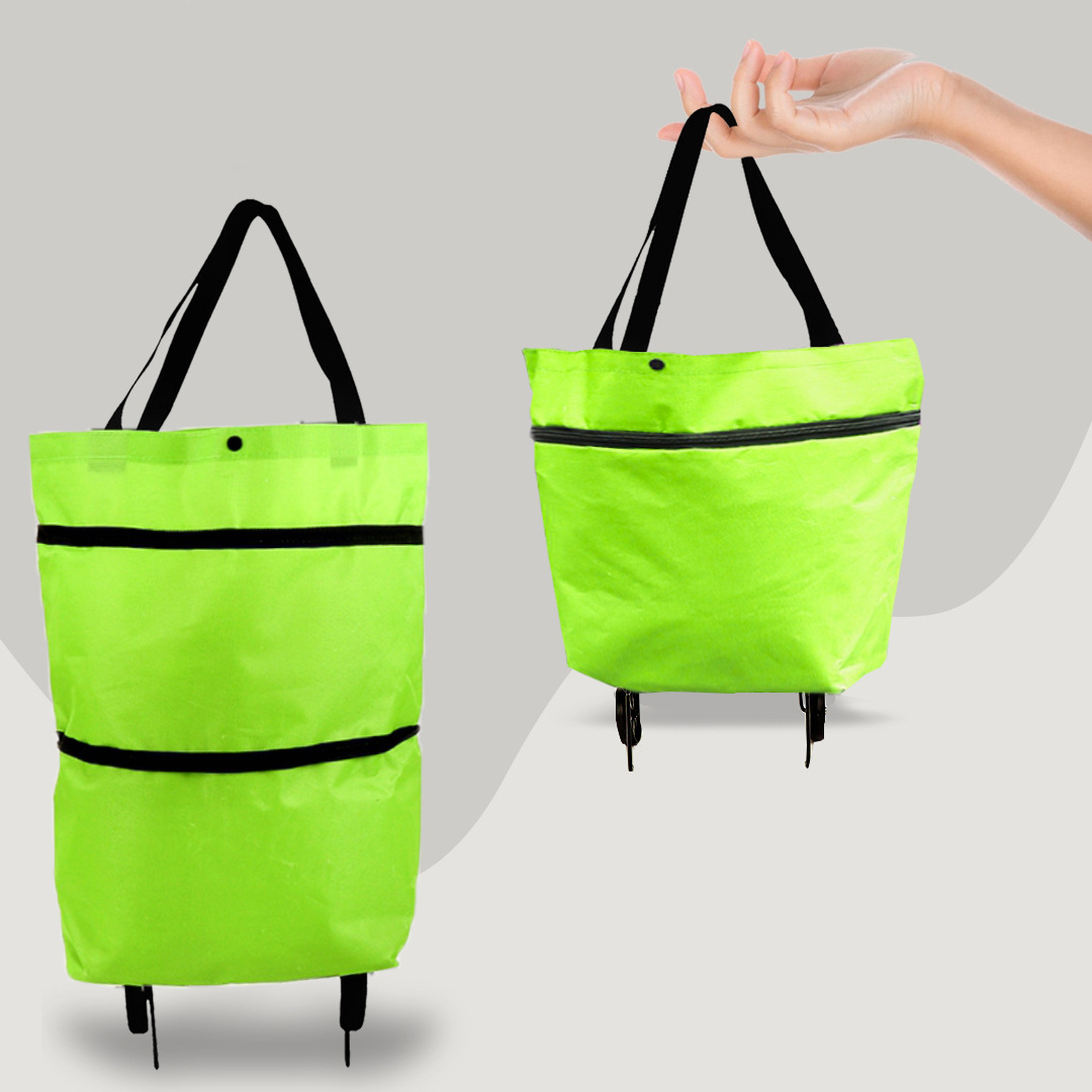 Green 2-in-1 trolley shopping bag shown in hand and standing upright with wheels
