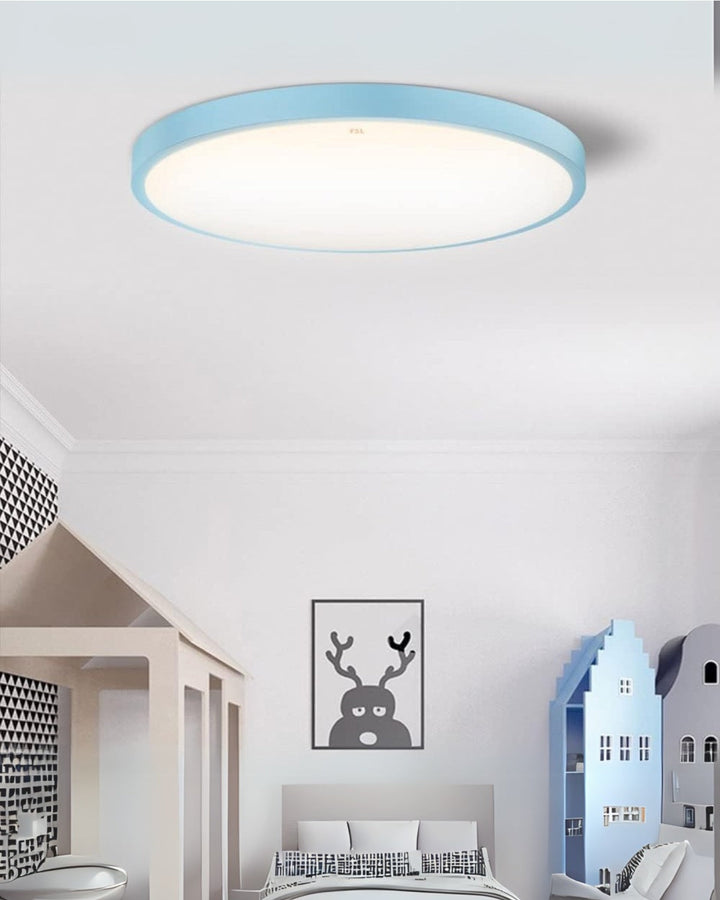 Contemporary round ceiling lamp installed in a minimalist living room