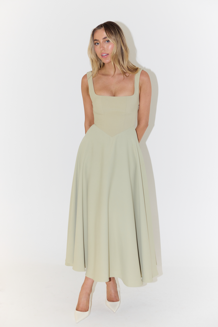 Back view of the elegant sage green casual midi dress