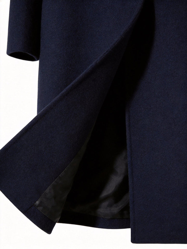 Side profile of the stylish men's long trench coat showcasing tailored fit and belted waist.