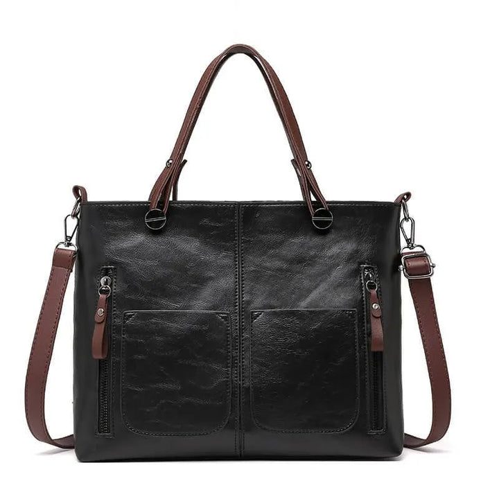 Women's black shoulder bag featuring dual front zipper compartments
