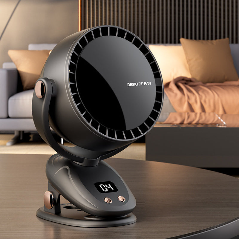Grey portable bladeless desk fan sitting on a wooden surface with a sofa in the background