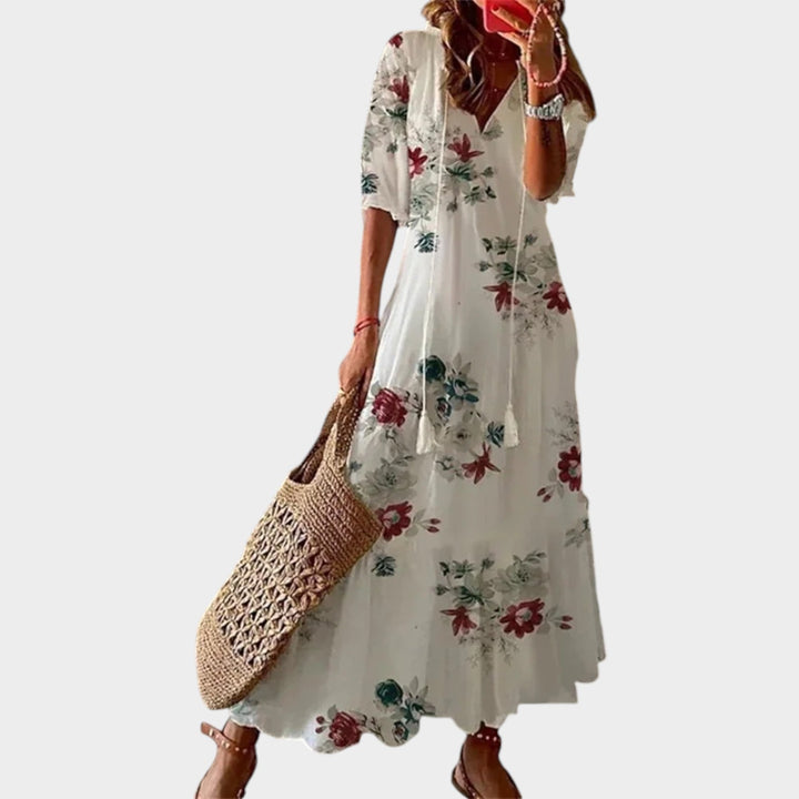 Woman wearing white floral boho maxi dress with a V-neckline