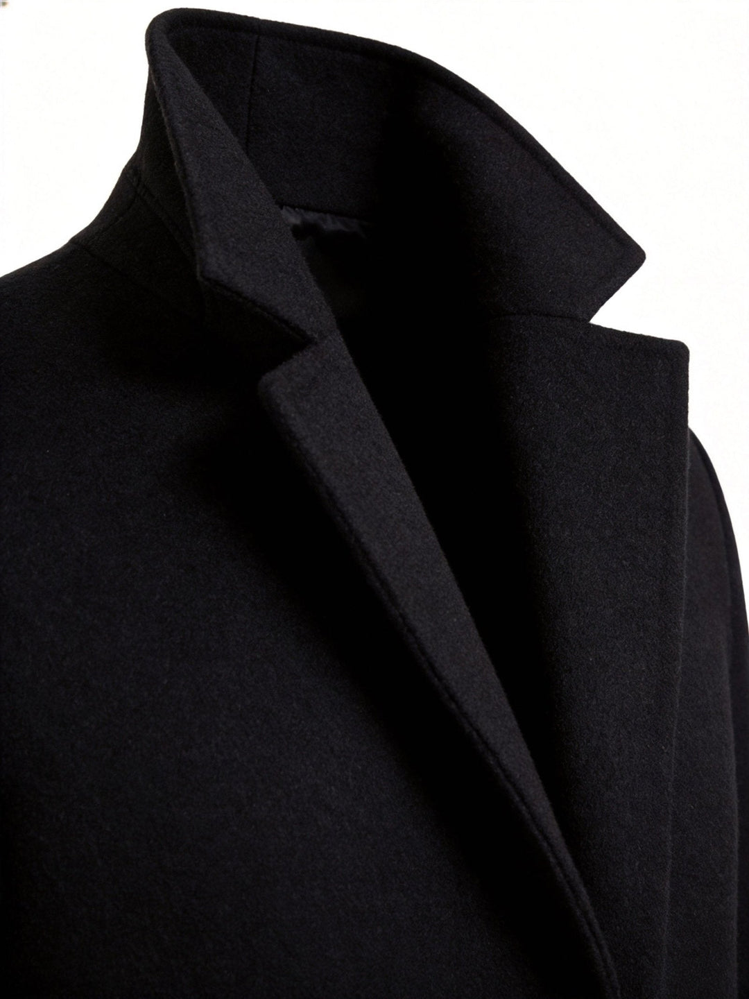 Shoulder epaulet detail on the classic men's trench coat adding military-inspired flair.