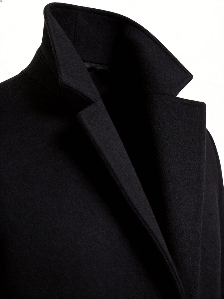 Shoulder epaulet detail on the classic men's trench coat adding military-inspired flair.