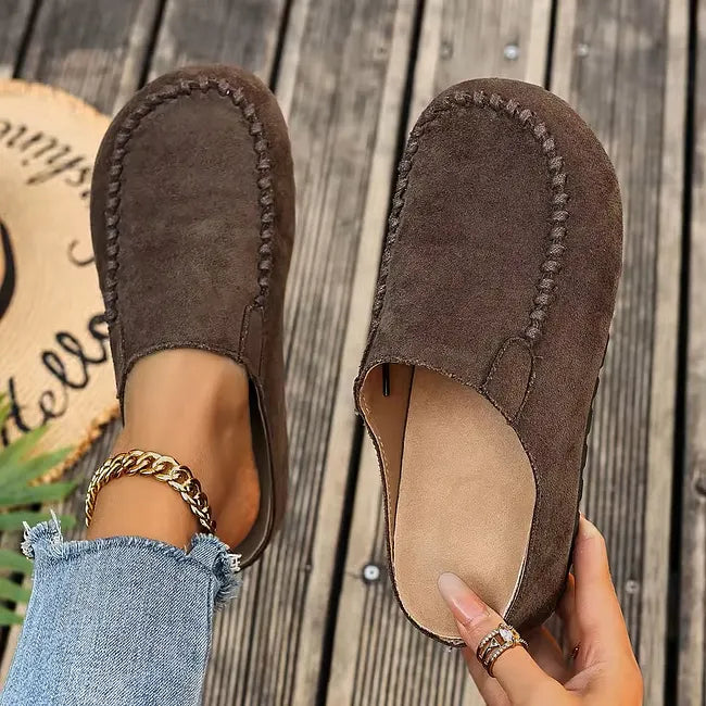Coffee brown slip-on casual sandals displayed with a flexible flat sole
