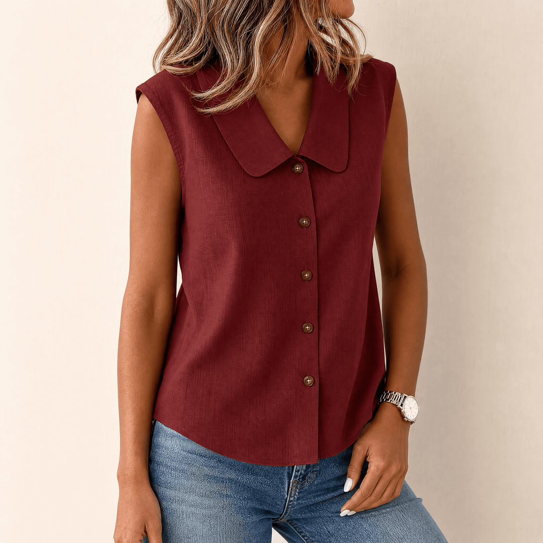 Collared sleeveless blouse paired with office chic accessories
