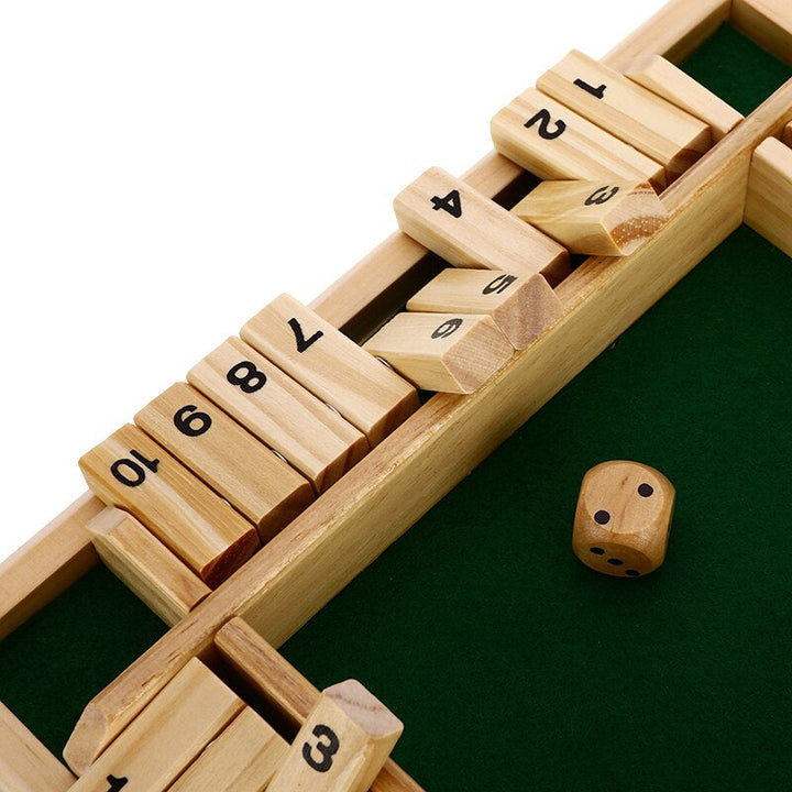 Child playing with educational wooden counting board game to practice early math skills