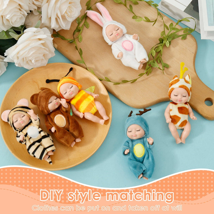 Mini reborn baby dolls arranged creatively with removable animal outfits for dress-up play