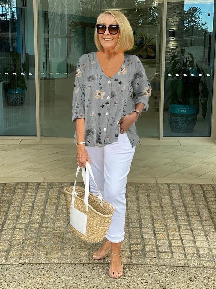 V-neck floral blouse styled for casual wear and warm weather