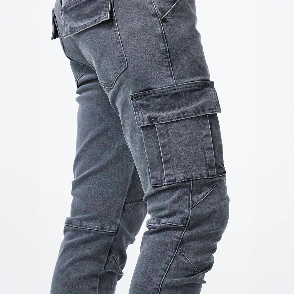 Close up of cargo pocket detail on mens slim fit cargo jeans in dark wash denim