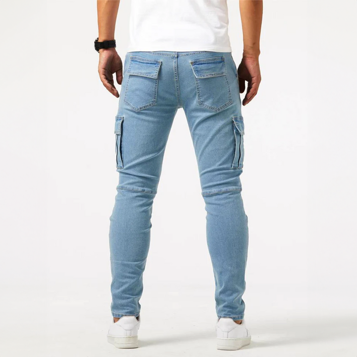 Flat lay of mens slim fit cargo denim pants styled for casual wear and utility look
