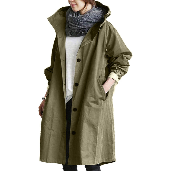 Woman wearing an army green long waterproof raincoat with hood