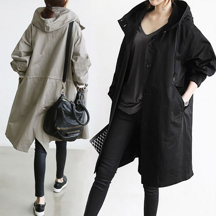 Back view of long outerwear raincoat demonstrating coverage