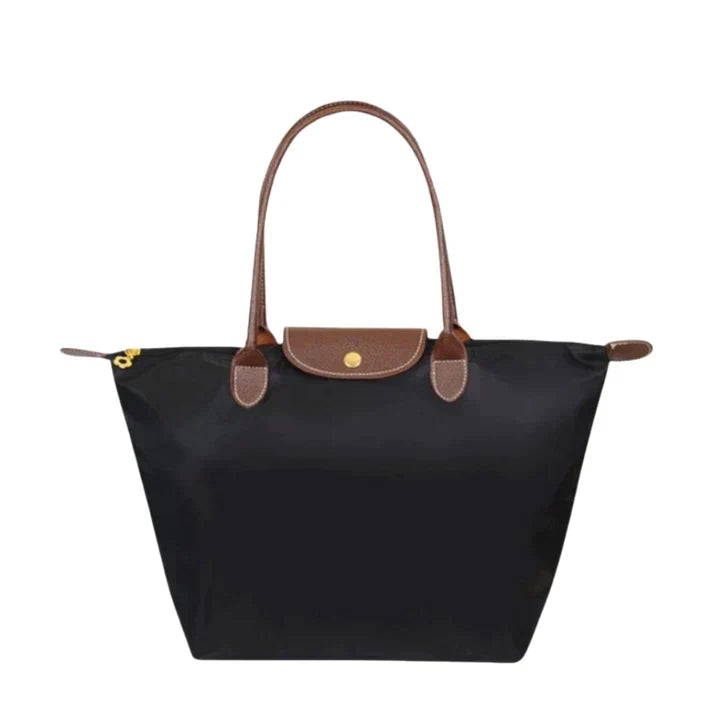 Women's black shoulder handbag with brown handles front view
